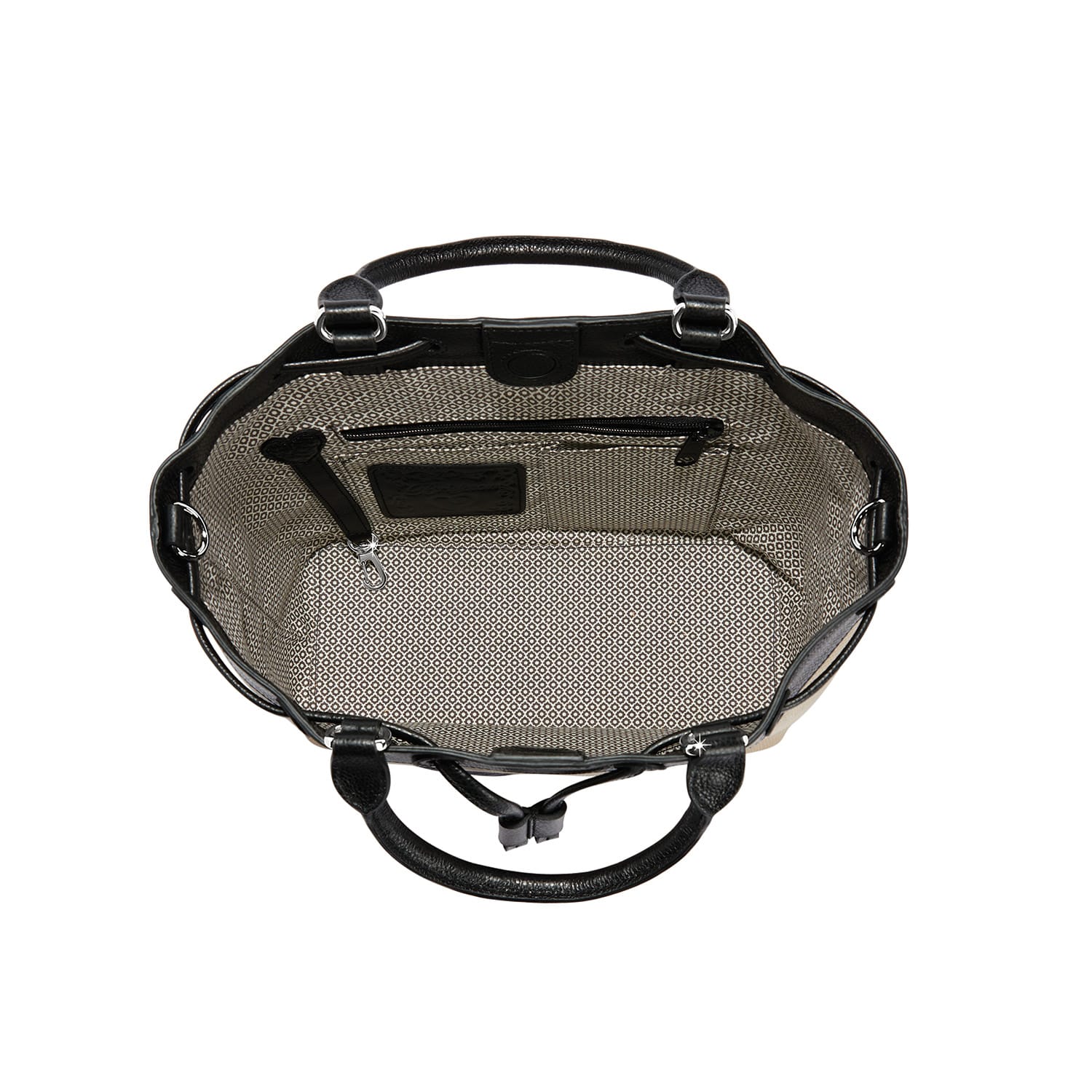 Close-up of Brighton handbag interior view with patterned fabric lining, zippered pocket, and black leather handles