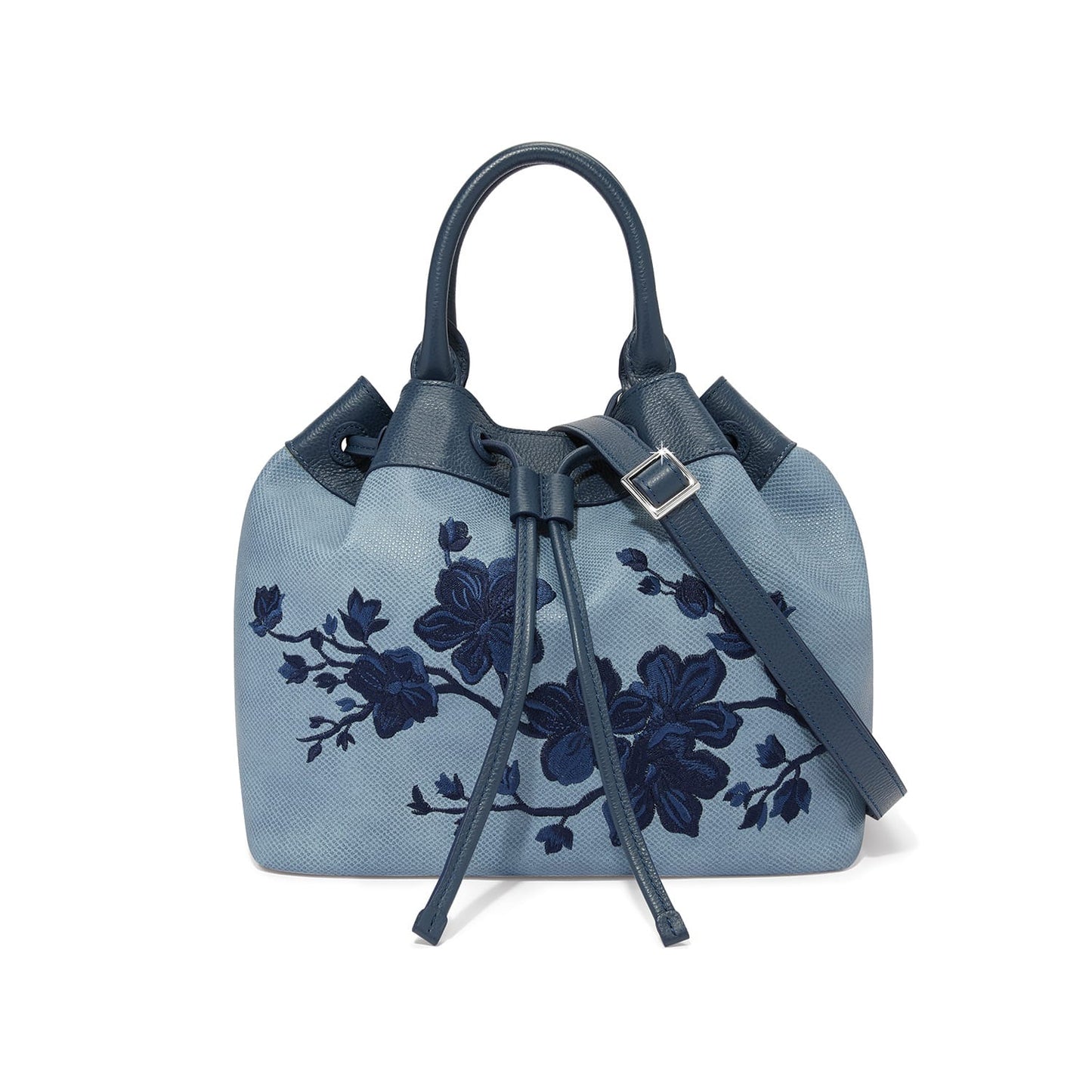 Brighton handbag in light blue with navy floral embroidery, leather handles, and drawstring closure on a white background