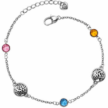 Brighton silver-plated chain bracelet with pink, orange, and blue crystal stations and filigree medallions on a white background