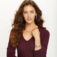 Model wearing Brighton silver-plated hoop earrings, scroll pendant necklace, and coordinating openwork bangle bracelets
