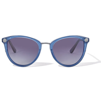 Brighton cat-eye sunglasses with blue translucent frames, gradient lenses, and silver-tone medallion accents on a white background