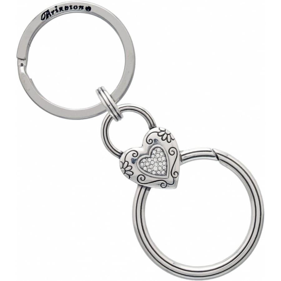 Brighton key fob with silver-tone heart charm, crystal center, scroll detailing, and dual split rings on a white background