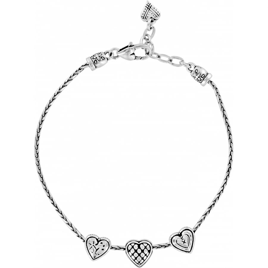 Brighton silver-plated bracelet with three heart charms featuring textured and checkered detailing on a white background