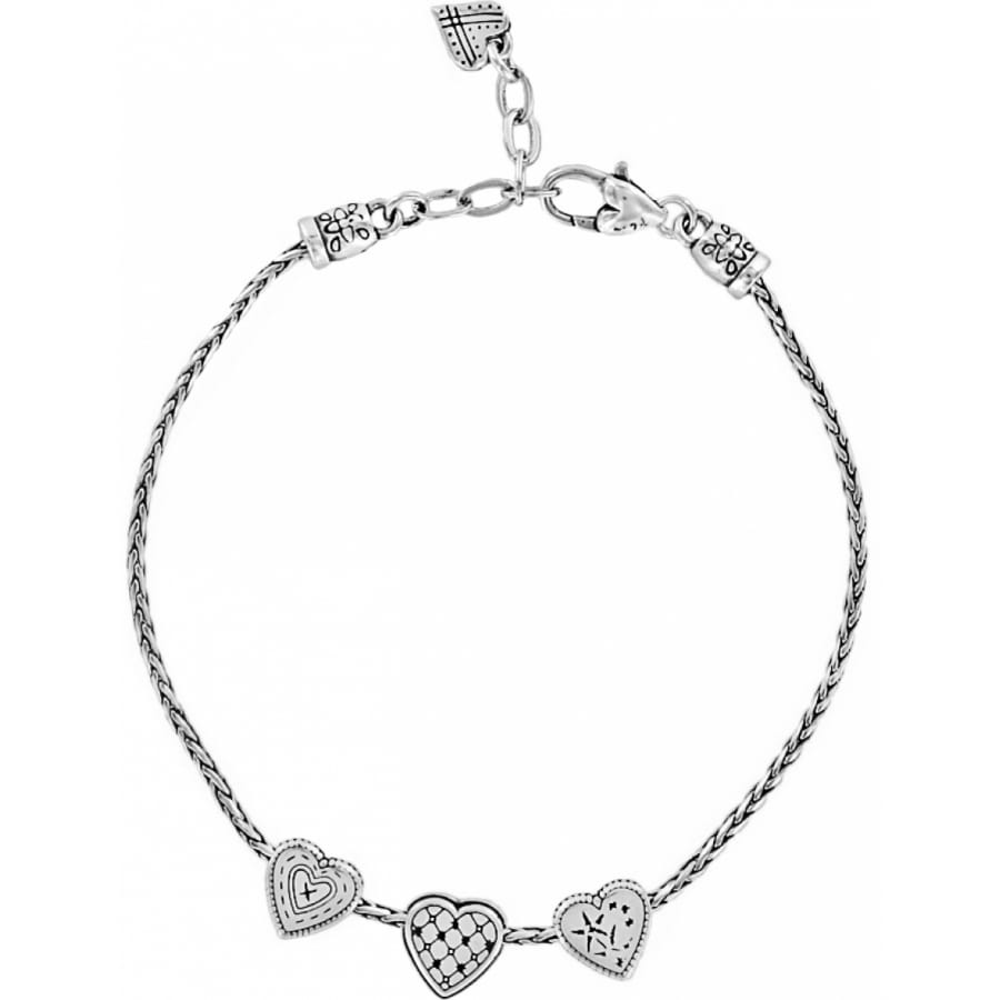 Brighton silver-plated chain bracelet with three heart charms featuring crystal accents and lobster clasp on a white background