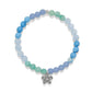 Brighton beaded bracelet with blue and green stone beads and silver-plated crystal flower charm on a white background
