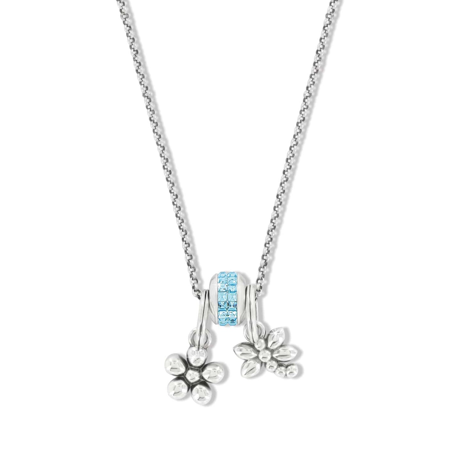 Brighton pendant necklace with blue crystal bead and two silver-plated flower charms on a white background