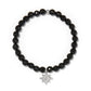Brighton beaded bracelet with faceted black beads and silver-plated crystal star charm on a white background