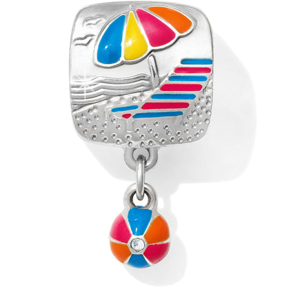Brighton silver-plated charm with colorful enamel beach umbrella scene and dangling beach ball accent on a white background