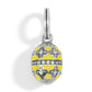 Brighton egg charm with yellow enamel, silver-plated floral motifs, and crystal accents on a white background