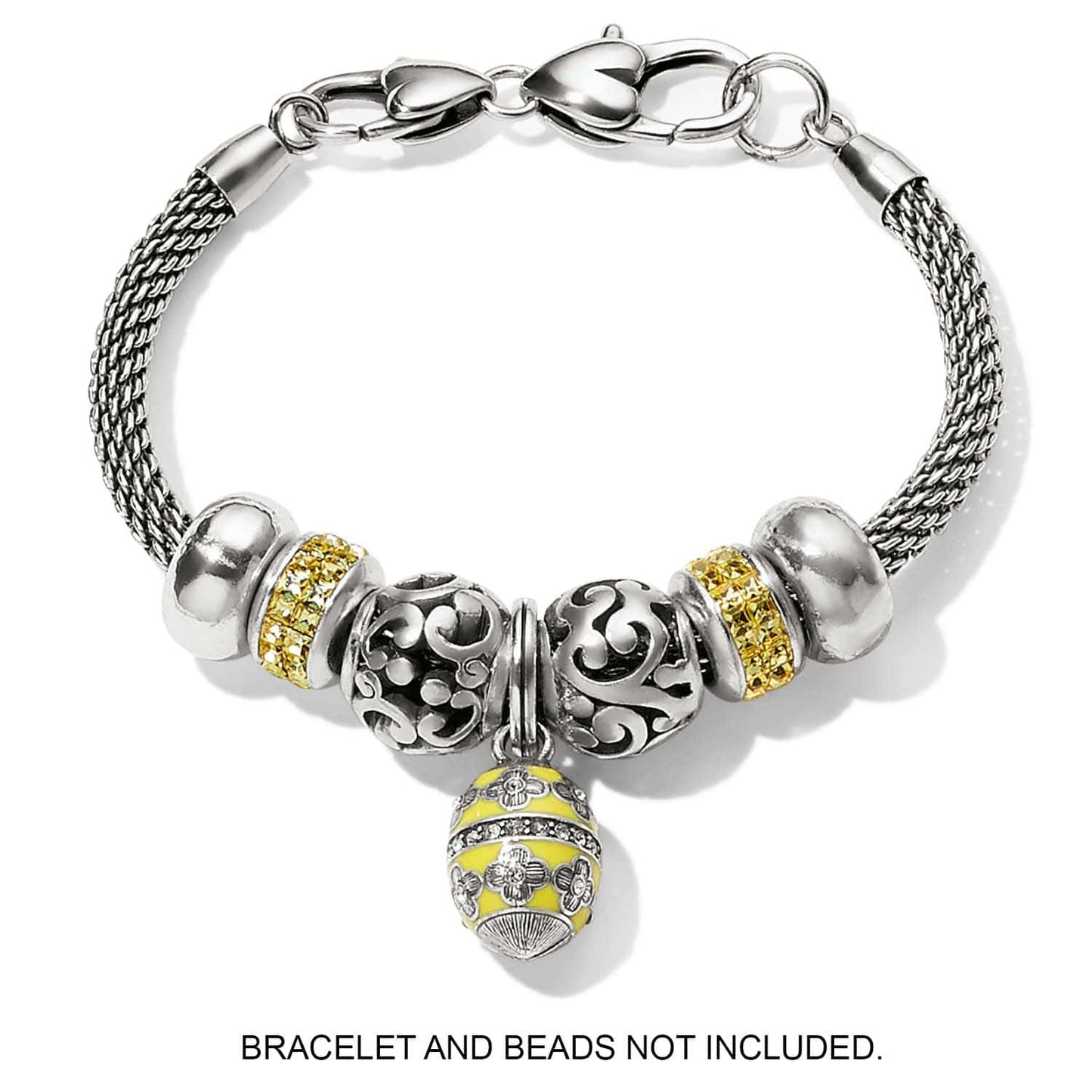 Brighton charms with silver-plated scrollwork beads, yellow crystal spacers, and yellow enamel floral egg drop on white background