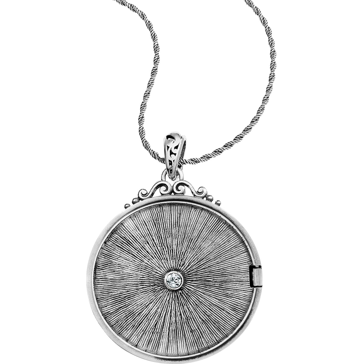 Brighton pendant necklace with silver-plated round locket, radiating sunburst texture, central crystal, and scrollwork bail on a white background