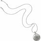 Brighton pendant necklace with silver-plated round locket featuring star and scroll filigree design on a white background