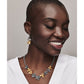Model wearing a Brighton two-tone floral necklace paired with matching silver and gold flower drop earrings