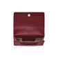 Brighton burgundy leather wallet shown open with card slots, patterned fabric interior, and silver-tone snap closure on a white background