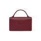 Brighton handbag shown from the back in burgundy pebbled leather with top handle and logo patch on a white background