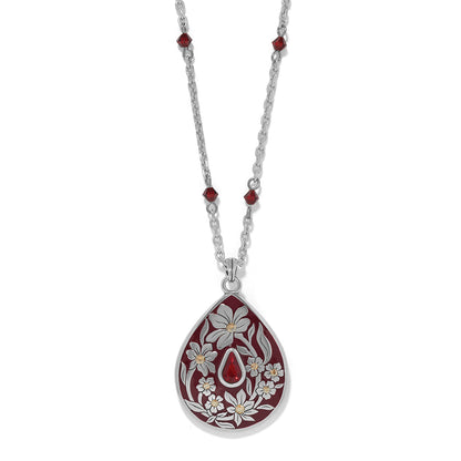 Brighton silver-plated pendant necklace with red enamel teardrop, white floral design, and red crystal beads on a white background
