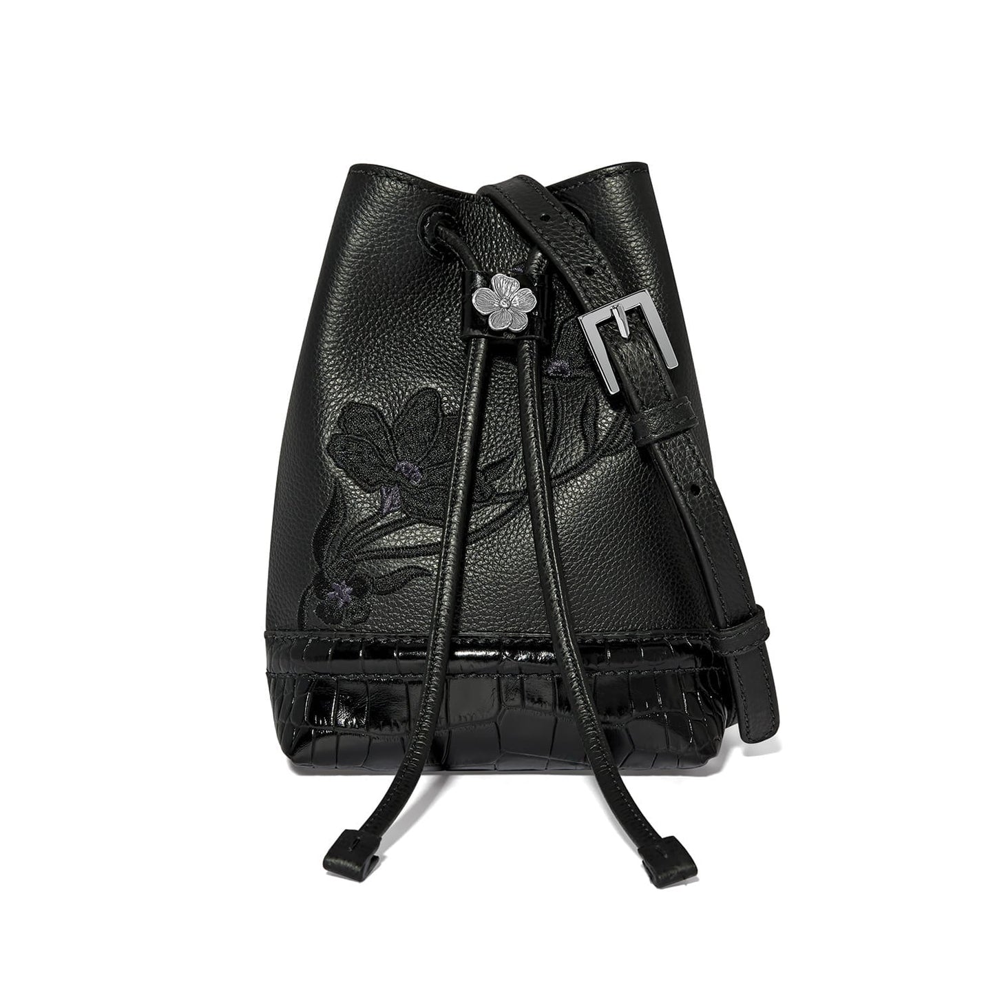 Brighton black leather bucket handbag with floral embroidery, croc-embossed base, and silver-tone flower drawstring on a white background