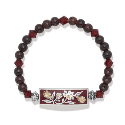 Brighton beaded stretch bracelet with dark red beads, crystal accents, and silver-plated floral enamel bar on a white background