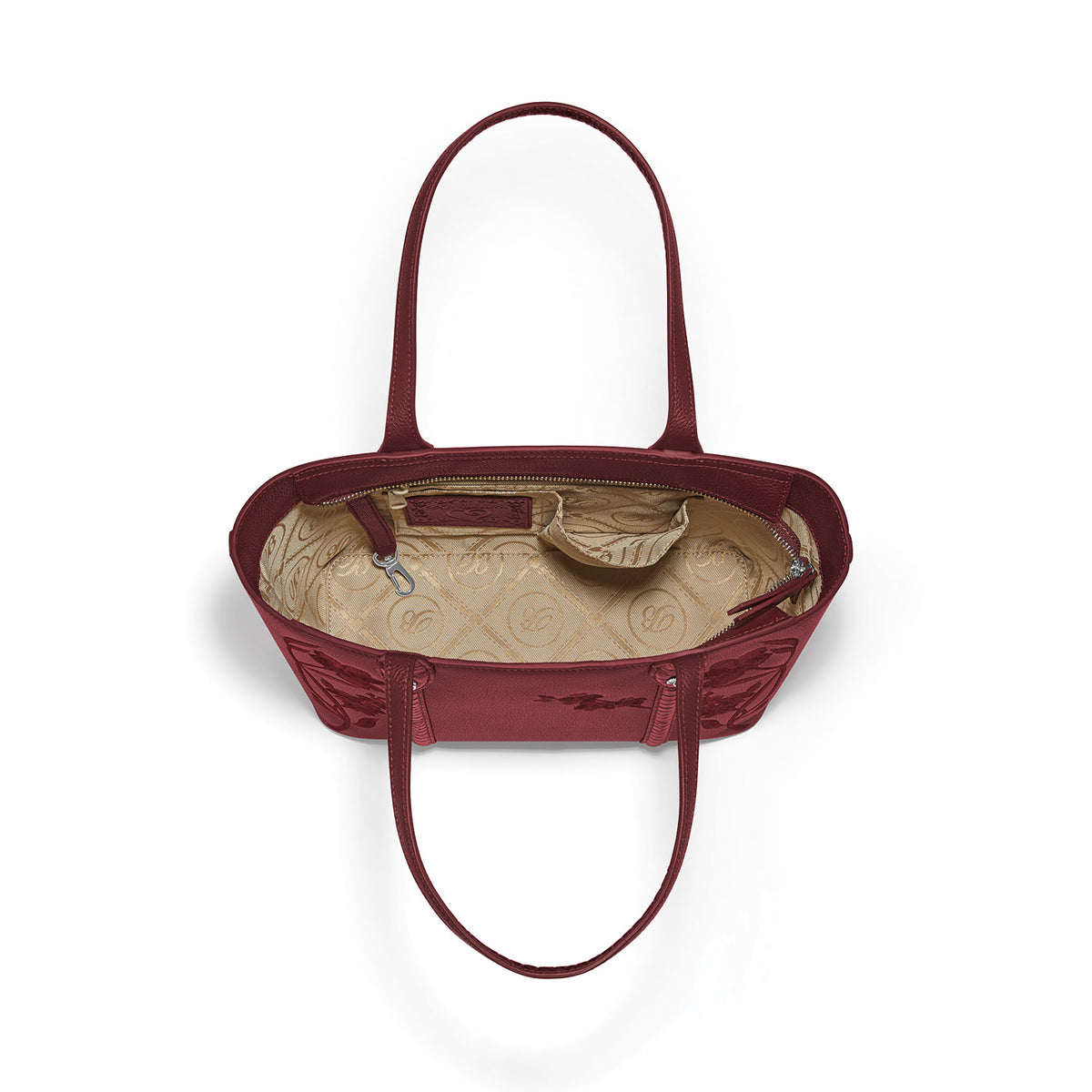 Brighton red leather handbag interior view showing patterned fabric lining, zip pocket, and dual shoulder straps on a white background