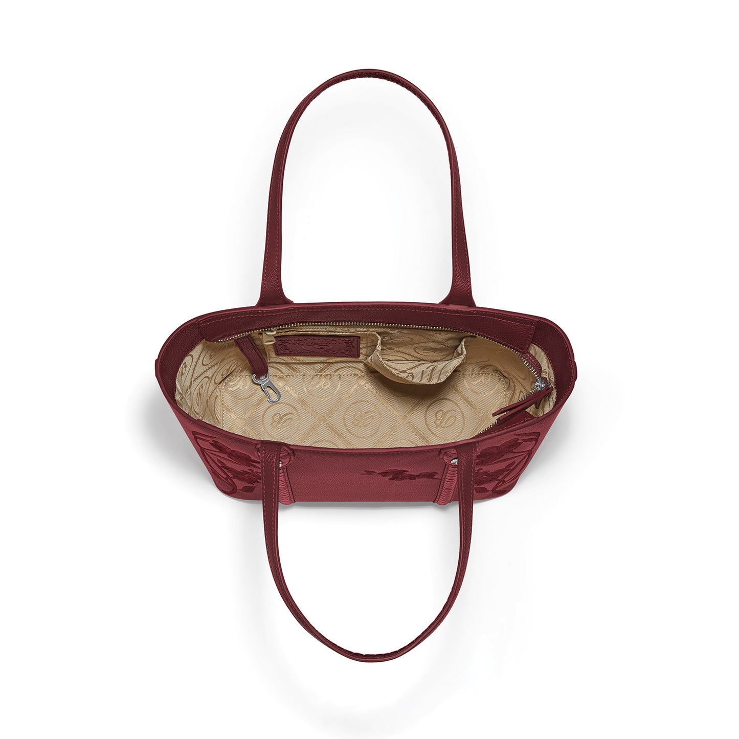 Brighton red leather handbag interior view showing patterned fabric lining, zip pocket, and dual shoulder straps on a white background