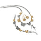 Brighton two-tone butterfly jewelry set styled with matching necklace, bracelet, and earrings featuring crystal accents on white