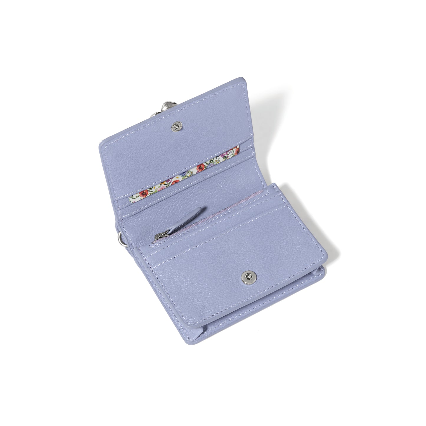 Brighton lavender leather wallet shown open with card slots, zippered coin pocket, and floral print interior on a white background