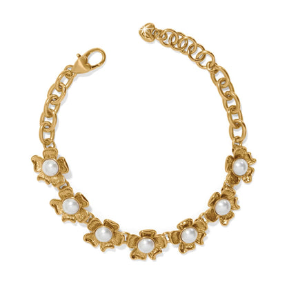Brighton gold-plated chain bracelet with glass pearl cabochon flower stations and heart-shaped clasp on a white background