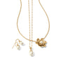 Brighton gold-tone jewelry set with pearl drop earrings, pearl pendant necklace, and floral pearl pendant on white background