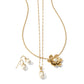 Brighton gold-tone necklaces and pearl drop earrings with crystal accents and flower pendant on a white background
