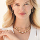 Model wearing a Brighton gold-plated floral necklace with glass pearls and coordinating Brighton accessories
