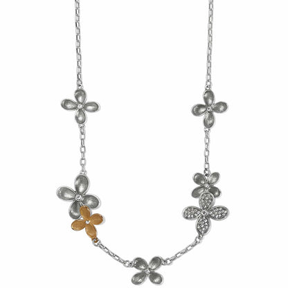 Brighton necklace with silver-tone and gold-tone flower stations featuring crystal accents on a white background