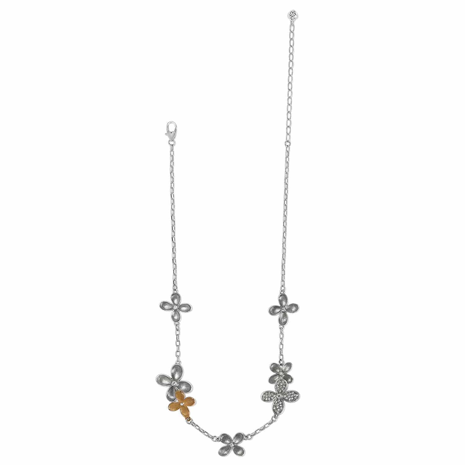 Brighton necklace with silver-tone flower stations, one gold-tone flower accent, and crystal centers on a white background