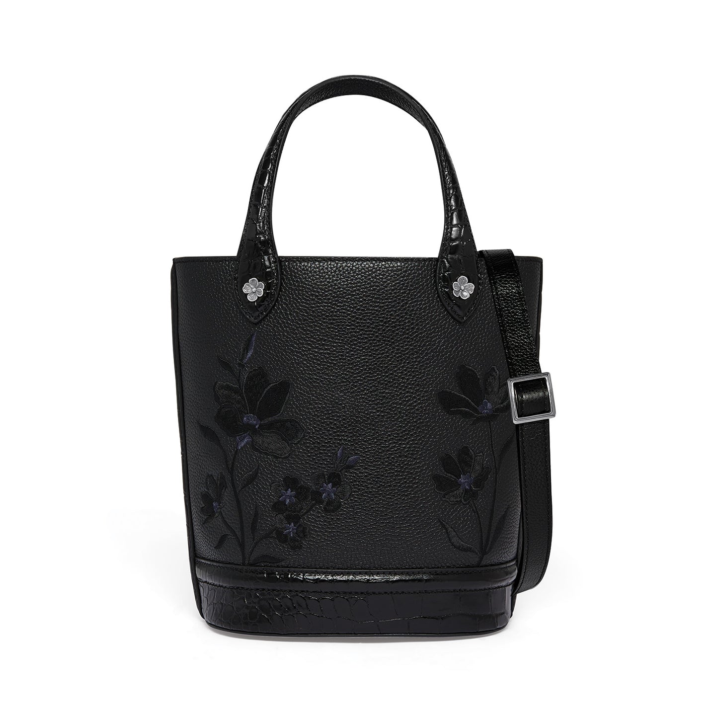 Brighton black leather tote handbag with floral embroidery, croc-embossed trim, and adjustable crossbody strap on a white background
