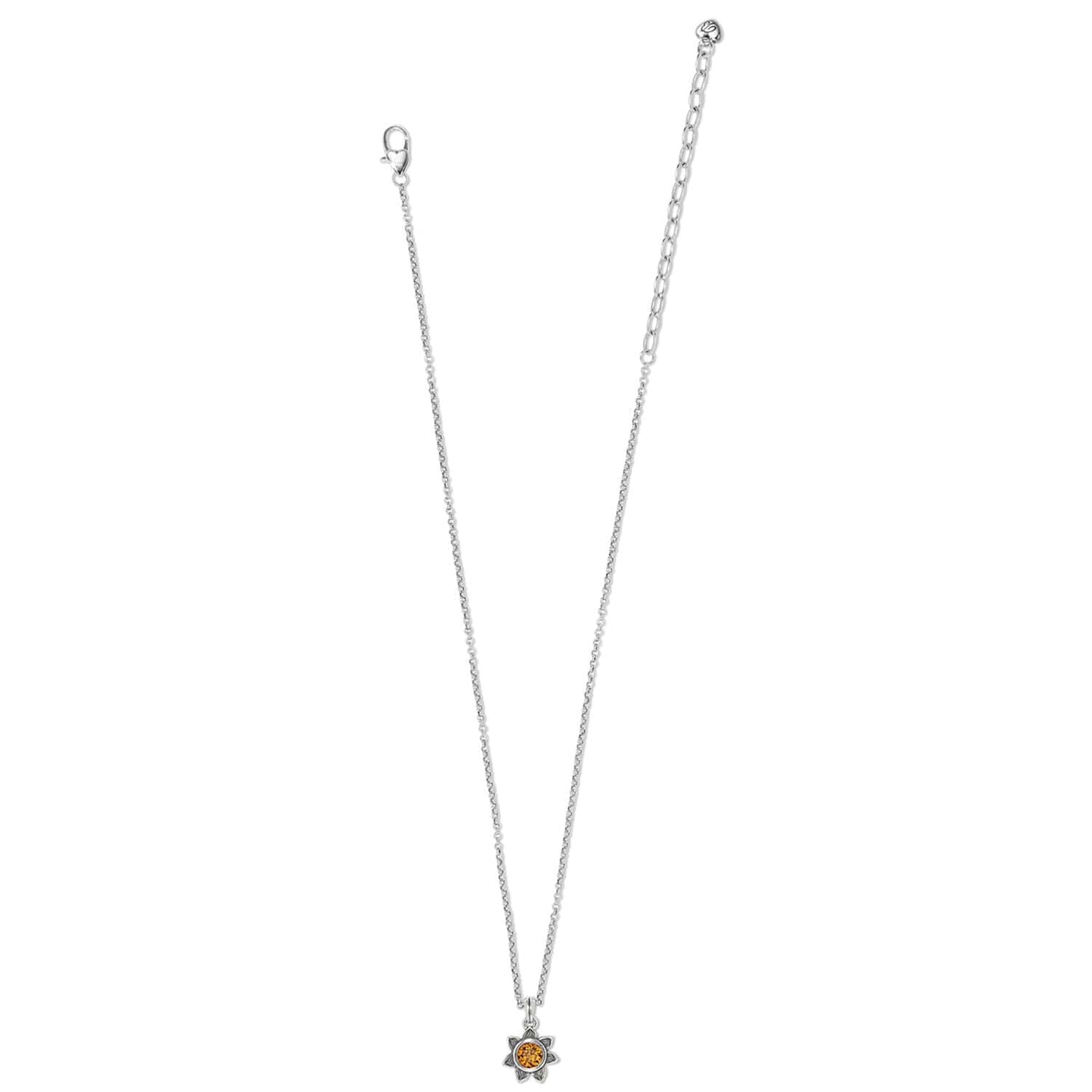 Brighton silver-plated chain necklace with small flower pendant featuring an amber crystal center on a white background