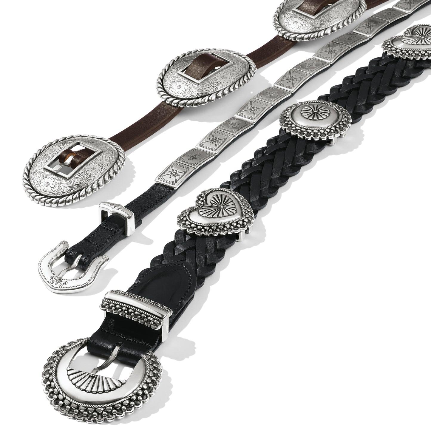 Brighton leather belts in brown and black with ornate silver-tone conchos, engraved buckles, and braided details on a white background