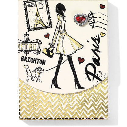 Brighton notepad with illustrated Paris scene featuring fashionable woman, Eiffel Tower stamp, and red crystal heart on a white background