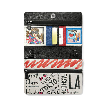 Brighton wallet shown open with card slots, illustrated fashion prints, zippered pockets, and graphic word print on a white background