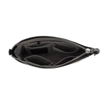 Brighton handbag shown open with patterned gray interior lining and silver-tone zipper on a white background