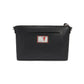 Brighton black leather handbag shown from the back with LOVE patch, slip pocket, and silver-tone hardware on a white background