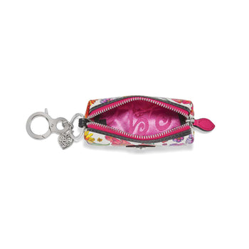 Brighton bag charm pouch shown open with floral print, pink lining, and silver-tone clip on white background