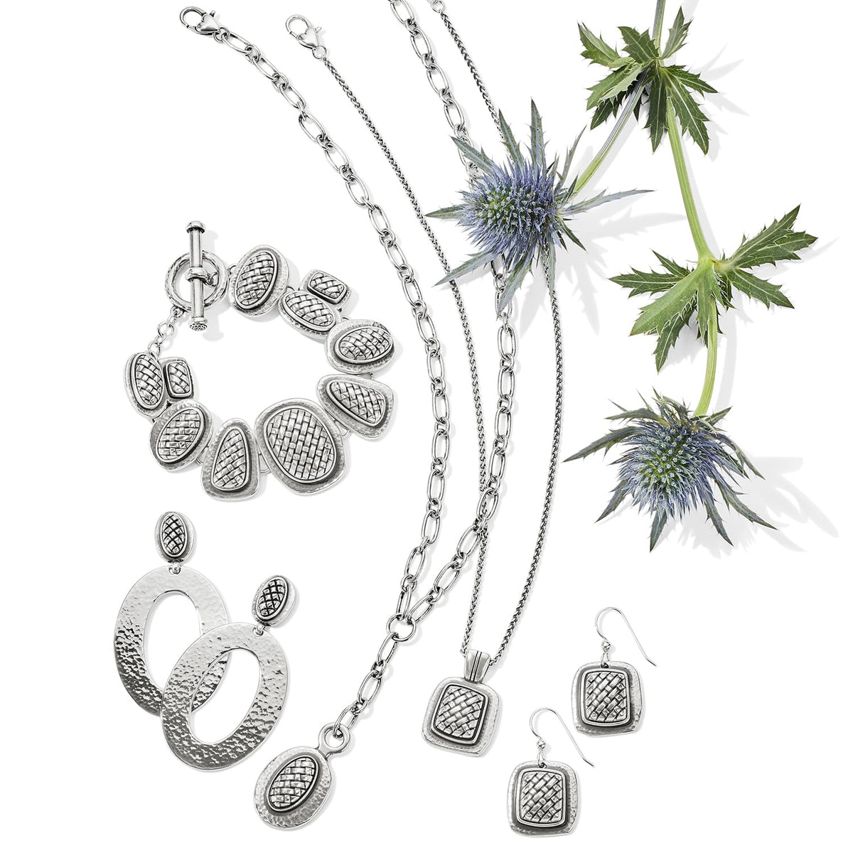 Brighton silver-plated jewelry set styled with matching bracelet, earrings, and necklaces alongside blue thistle stems