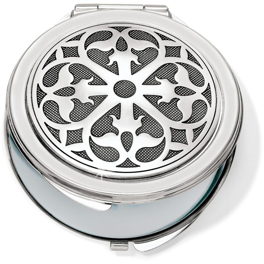 Brighton compact mirror with round silver-tone lid featuring ornate scrollwork medallion design on a white background