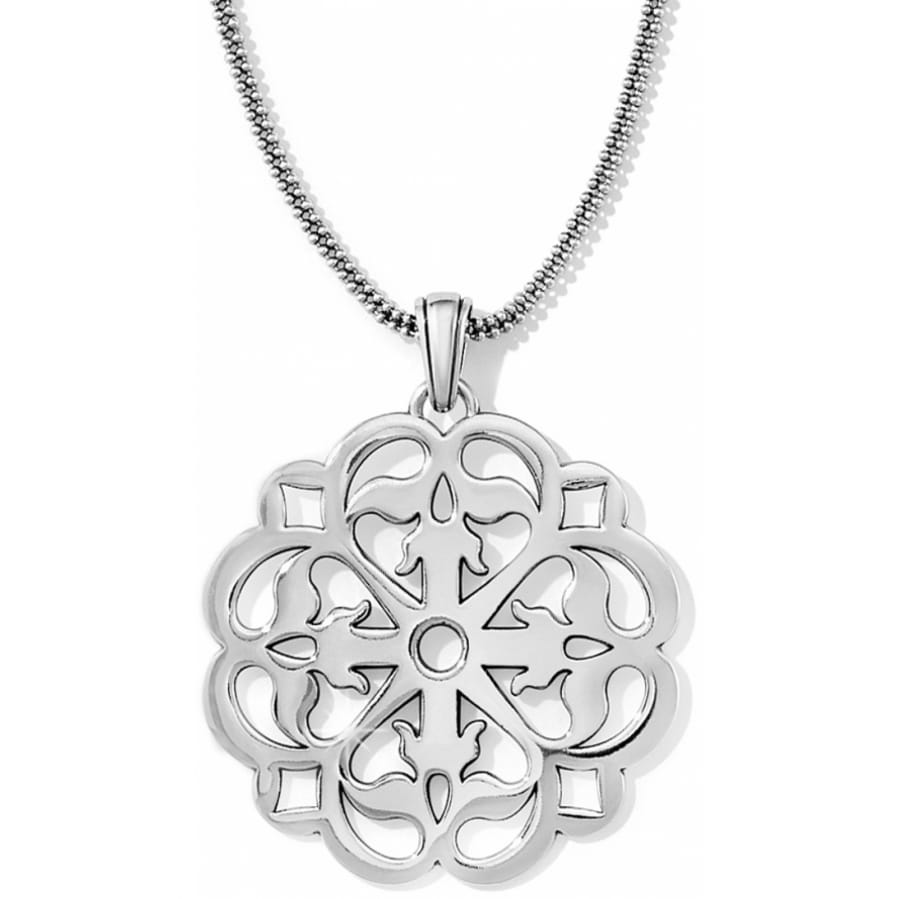 Brighton pendant necklace with silver-plated scalloped medallion featuring ornate openwork scroll design on a white background