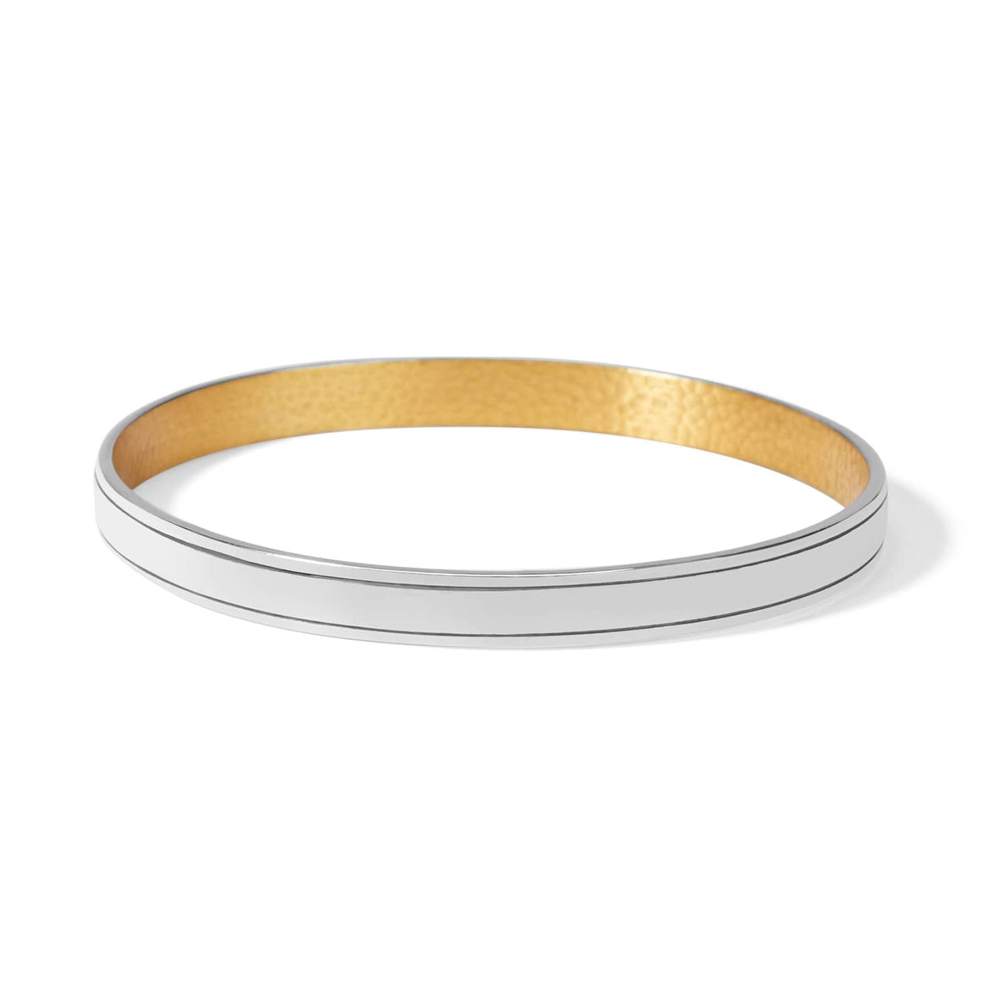 Brighton bangle bracelet with polished silver-tone exterior and warm gold-tone hammered interior on a white background
