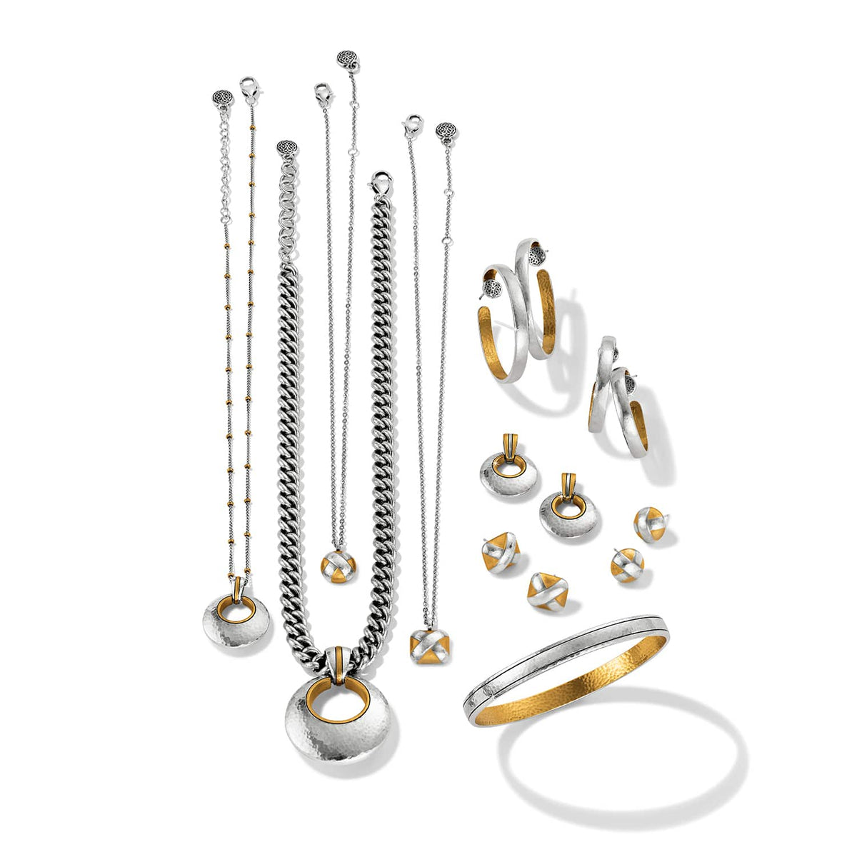 Brighton two-tone jewelry collection styled with necklaces, earrings, and a bangle bracelet on a white background