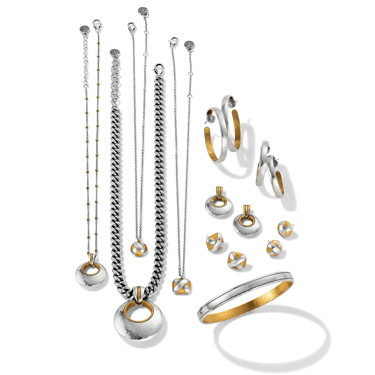 Brighton jewelry collection styled with two-tone necklaces, hoop earrings, stud earrings, and a hammered bangle bracelet