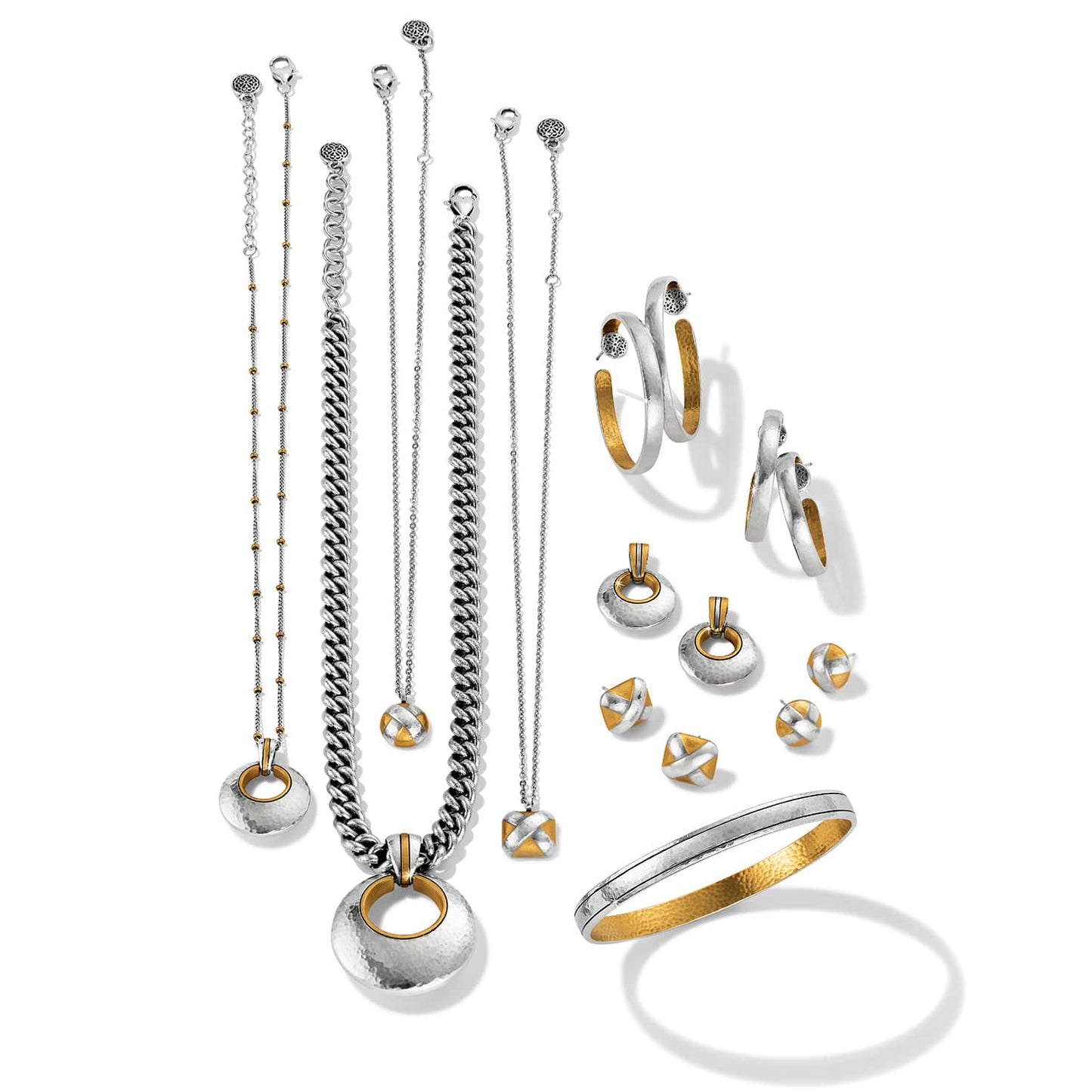 Brighton jewelry collection styled with two-tone necklaces, hoop earrings, stud earrings, and a hammered bangle bracelet