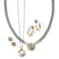 Brighton jewelry styled with two-tone necklaces, hoop earrings, and stud earrings featuring filigree medallion accents on a white background