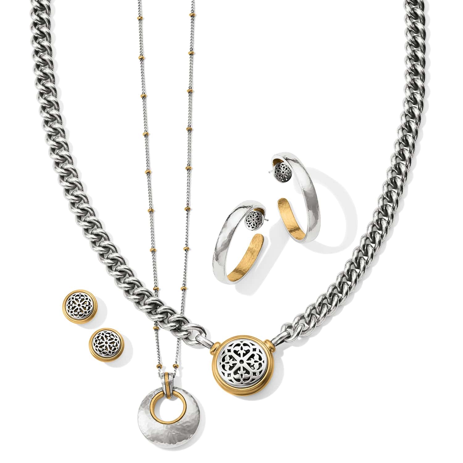 Brighton jewelry styled with two-tone necklaces, hoop earrings, and stud earrings featuring filigree medallion accents on a white background