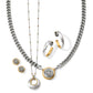 Brighton jewelry styled with two-tone necklaces, hoop earrings, and stud earrings featuring filigree medallion accents on a white background
